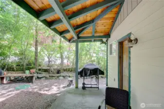 Covered patio on back of cabin allows year round outdoor enjoyment, cooking, and hanging!