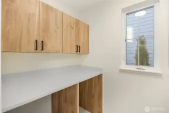 Spacious main floor laundry room.