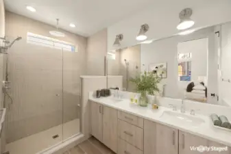 Spa-inspired primary bath with heated floors and thoughtfully selected tile.