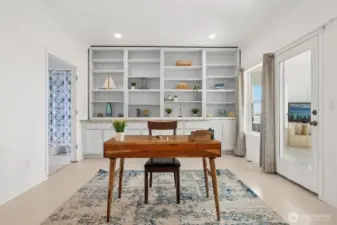 The library/office on the second floor has double pocket doors and plenty of storage.