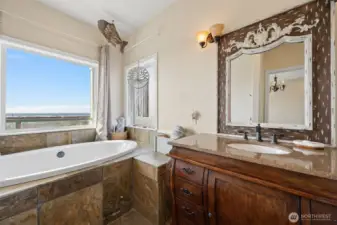 Luxurious soaker tub, also with ocean views in the second primary suite.