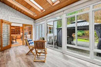 This new sunroom is designed to let the outdoors in! It is adjacent to the great room and dining room.