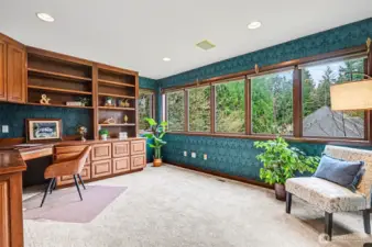 The office is tucked away near the primary suite at the opposite end of the home.