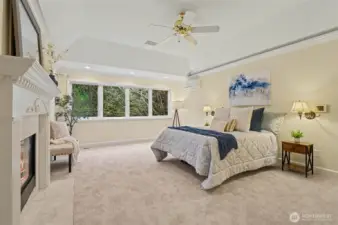 The primary suite offers a peaceful escape, offering a double-sided fireplace, a large walk-in closet, 5-piece bathroom and complemented by a private office and tranquil outlooks.