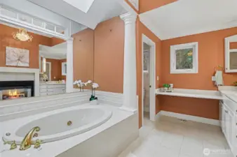 Relax and unwind in this jetted soaking tub & enjoy the warmth of the fireplace.