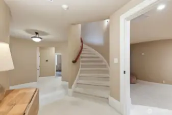 Lower hallway leading to 2 more spacious bedrooms, media room and rec room.