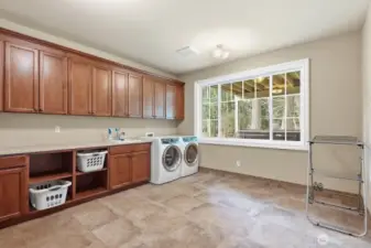 Lower level huge laundry room.