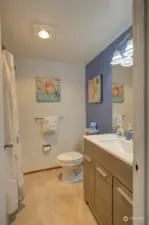 Just past the bedroom is the laundry closet, (yes, we have in unit laundry!) then the centrally located bathroom.  New vanity and fixtures make everything look and feel shiny and new!