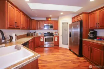 Spacious kitchen with stainless steel appliances. Look at all those cabinets, plus a roomy pantry!