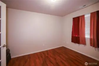 Roomy bedroom? Home Office? Craft Room? The double doors with the paned windows add a bit of class. Right off the kitchen, this room could be used for just about anything.