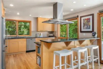 Updated kitchen with stainless appliances, newer cabinetry, and granite countertops