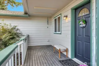 Spacious front porch is the perfect place to gaze out at Port Susan and to admire Mount Baker.