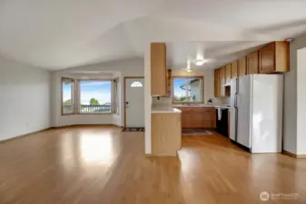 Living room and kitchen, taken from the dining area.