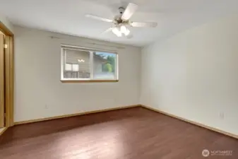 Primary bedroom with en-suite bathroom and large closet.
