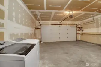 Laundry in the spacious 2 car garage.