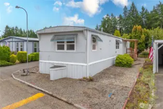 Low maintenance lot - showing the front entrance w/ deck.