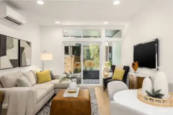 Open living room offering a natural gathering place for entertaining. Also includes easy access to the courtyard.