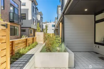 Fenced courtyard patio extending your living space outdoors — ideal for entertaining or quiet relaxation.