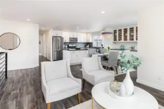Light-filled open concept layout with huge south-facing windows invites the sunshine in.