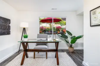 Office with amazing natural light looks out to colorfully landscaped backyard.