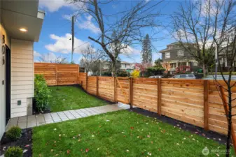 Home is street facing with a fully fenced and level front yard.