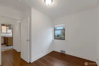The bedroom off the kitchen could be ideal for an office, workout space or bedroom. Either way, you'll love the deep walk-in closet in this room!