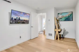 Ground level bedroom has a nice little nook that can be used for a desk for work from home.