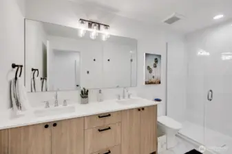 Double vanity with contemporary fixtures. Walk-in shower. Crisp finishes and practical layout. Heated floors for those early cold mornings.