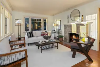 Generous sized living room facing the views with walls of windows to let in the light and natural surroundings.