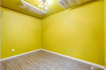 This extra room is built in the converted garage area, could be used as a little office, studio, workout space...you decide!