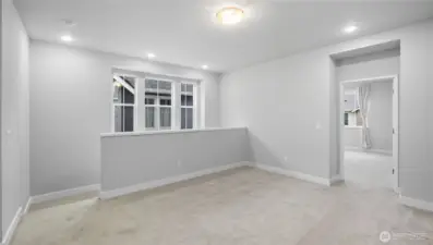 At the top of the stairs is a versatile large bonus room/loft