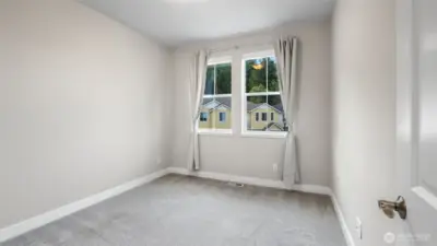 Second upper level bedroom with walk-in closet
