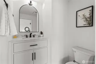 Custom 1/2 bath perfect for quick access and guests