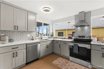 Lots of windows allow much needed light. Window over the sink allows for partial views along with viewing who is coming to visit