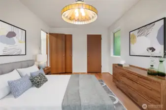 Bedroom off entry on the main level of the home - nice original hardwood floors - Virtually staged to show potential.