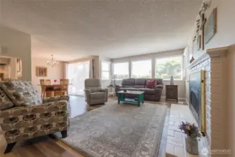 Light-filled living room with large picture windows.
