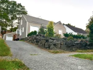 Front View with driveway to 2 car garage