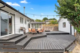 Back slider leads to large deck and access to door to 3-car garage.