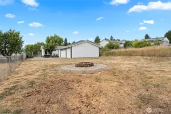 Large back yard with fire pit for those late night lounging.