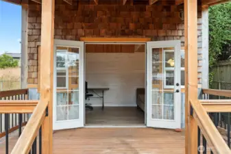 Double doors lead from this covered porch to the 160 sf