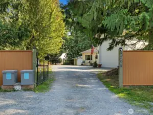 The property is located in a gated community and also features its own private gate. The photo shows the ADU along with the RV bay door.