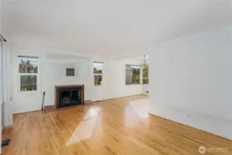 Here we are finally in the house. Looking East f rom the front door & hall closet.  All original wood flooring