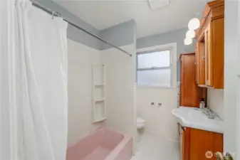 Full Bath upstairs with original pink 1940's tub
