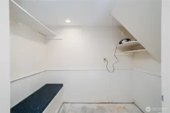 Mudroom/storage area on other side of outside/entry basement door.