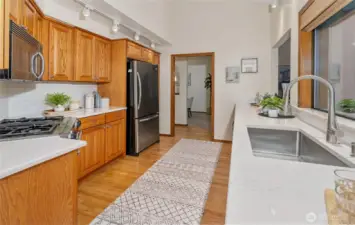 View looking back through the kitchen from the sunroom/eating nook.