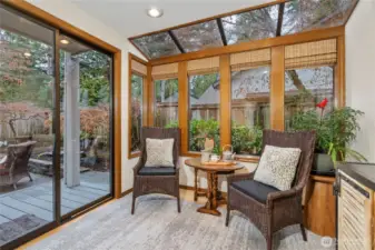Sunroom/eating nook off the kitchen with slider leading to back deck and yard.