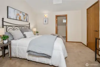View from the second upstairs bedroom looking toward the large closet or additional storage room.