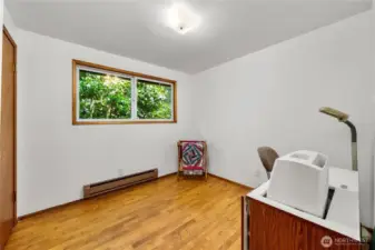 Bedroom #2. Large pink camellia tree just outside the window.
