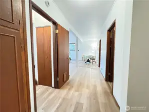 Entrance from the garage. Storage closet on the left and stairs after that. Half bath on the right and laundry after that. All brand new LVP flooring installed.