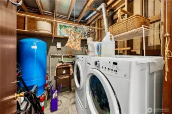 Laundry room with the well pressure tank.